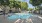 outdoor swimming pool beside the Haven at Towne Center apartment building